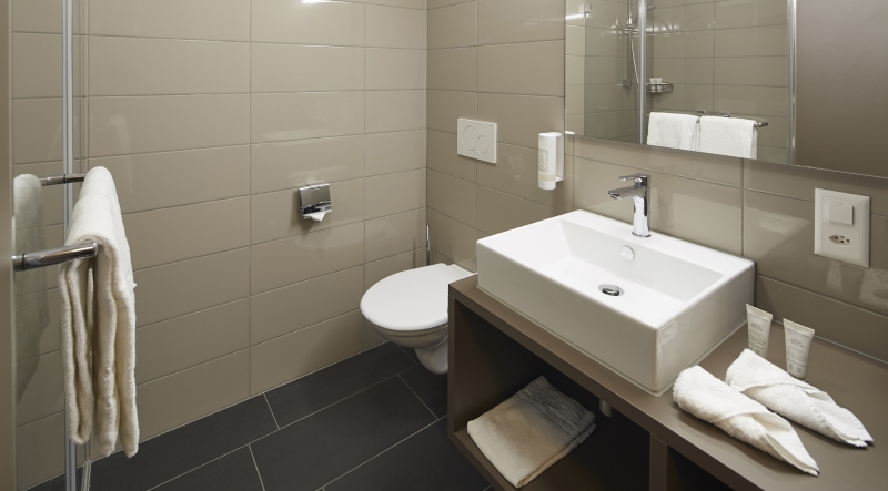 Das Bad im Businesszimmer des Hotels Aparthotel Baden