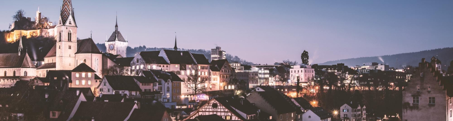 View of the illuminated city of Baden near the apart hotel near zurich