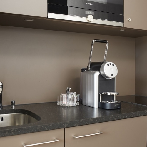 Nespresso coffee machine on the kitchenette of the apart hotel near zurich